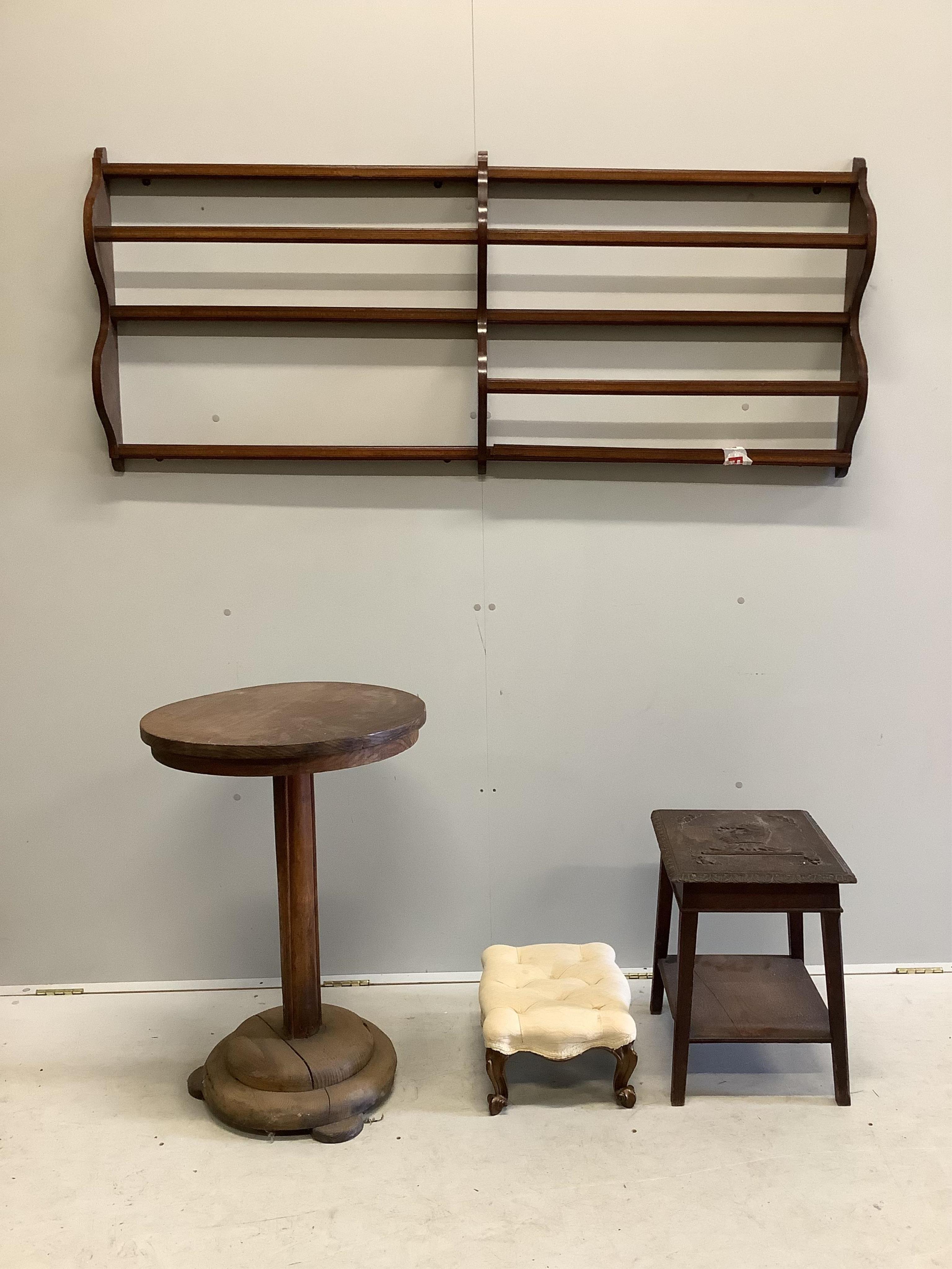 An Edwardian inlaid mahogany plate rack, length 162cm (a.f), together with a Victorian footstool, a carved two tier table and a circular occasional table. Condition - poor to fair